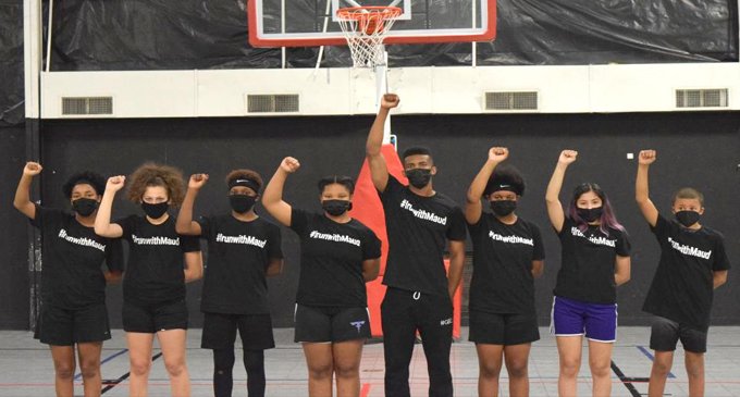 Coach and players pay homage to Ahmaud Arbery a year after being slain